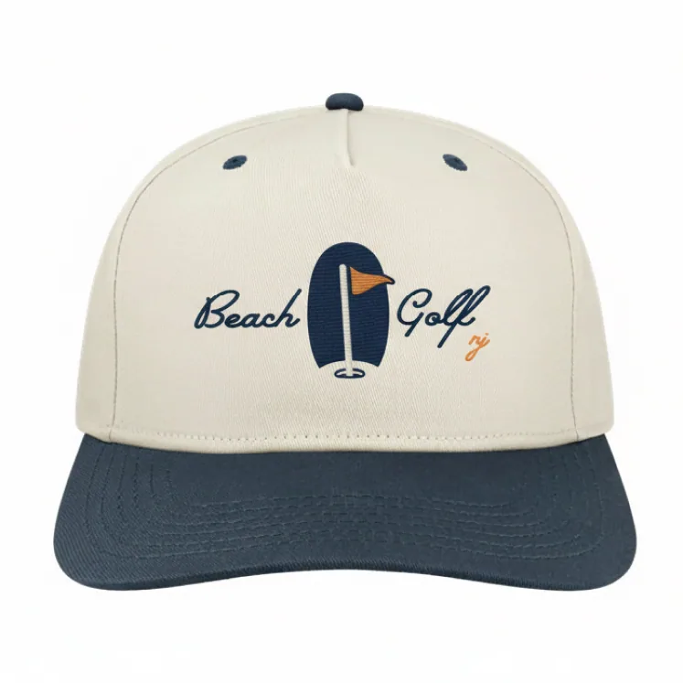 Cream and navy rope cap with the Beach Golf script mark
