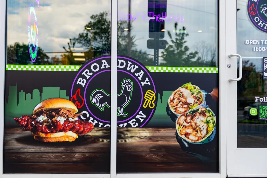 Entrance door decal with the roundel logo and food photography