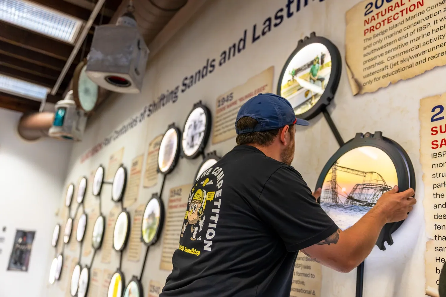Installing a circular porthole frame on the timeline wall